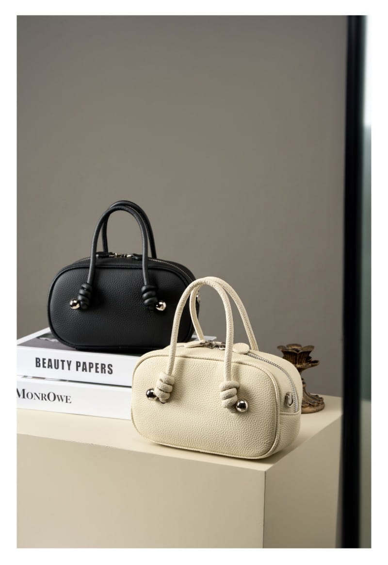 Modern Leather Handbag with Twisty Design