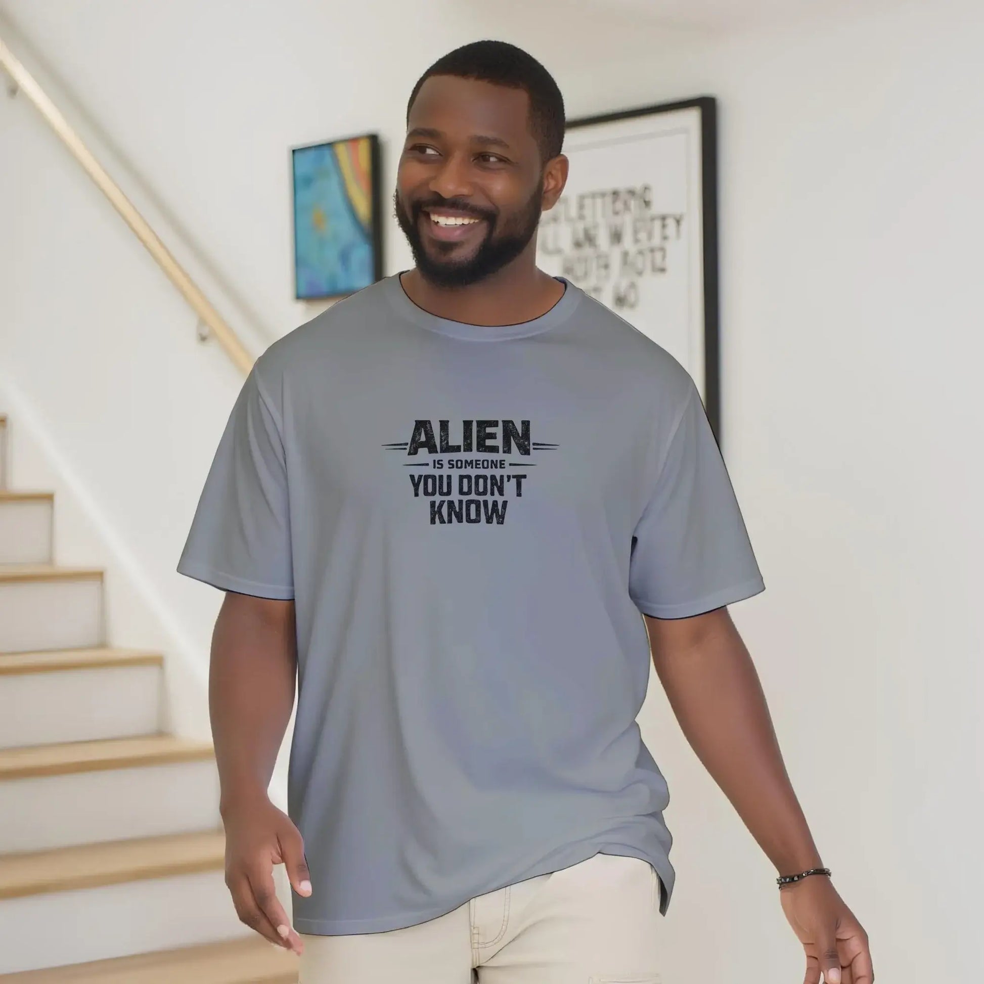 Alien Urban Graphic T-shirt, sport grey color, featuring the text 'ALIEN SOMONE YOU DON'T KNOW', worn by a smiling man.