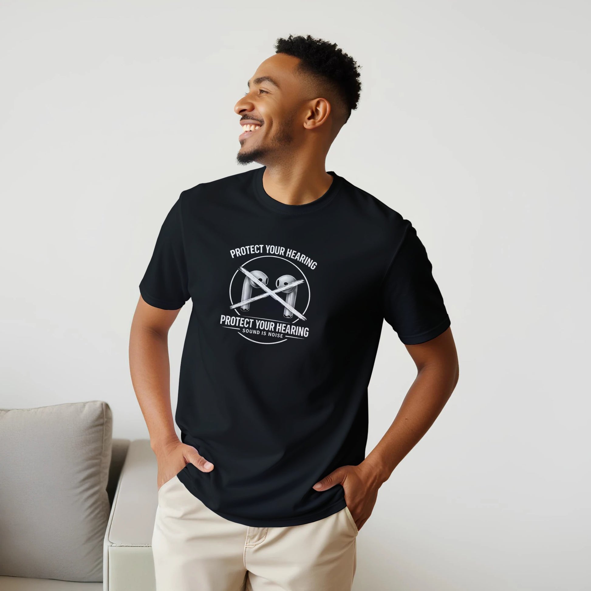 Man wearing a black Protect Your Hearing Tee, showcasing the message against loud noise.