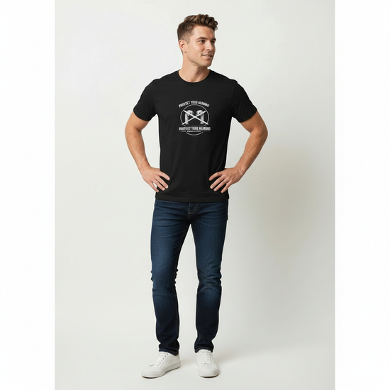Man poses in black Protect Your Hearing Tee showcasing a hearing protection message on a stylish t-shirt.