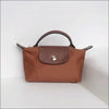 Longchamp Le Pliage Cognac stilren fransk minimalism - Mini Pack & Axelband - Sminkväska