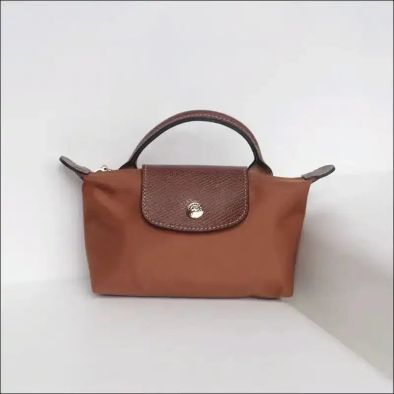 Longchamp Le Pliage Cognac stilren fransk minimalism - Mini Pack & Axelband - Sminkväska