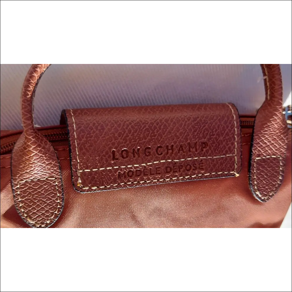 Longchamp Le Pliage Cognac stilren fransk minimalism - Mini Pack & Axelband - Sminkväska