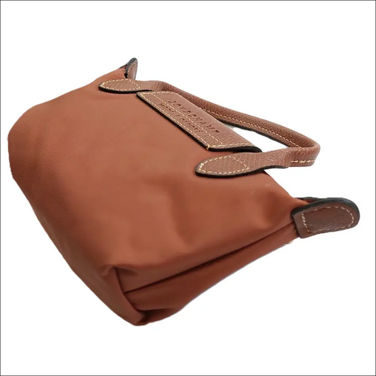 Longchamp Le Pliage Cognac stilren fransk minimalism - Mini Pack & Axelband - Sminkväska
