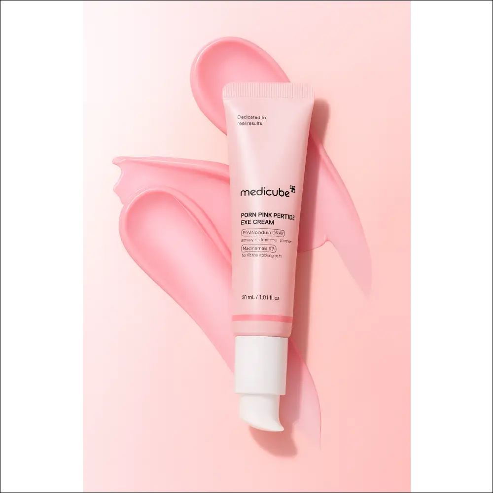 Medicube Eye Cream – PDRN Peptide in a pink tube with cream swatches, offering hydration for the under-eye area.