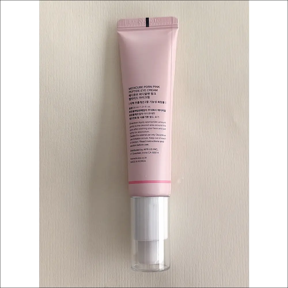 Medicube Eye Cream – PDRN Peptide in a pink tube, designed for nourishing and rejuvenating the eye area, 30 ml.