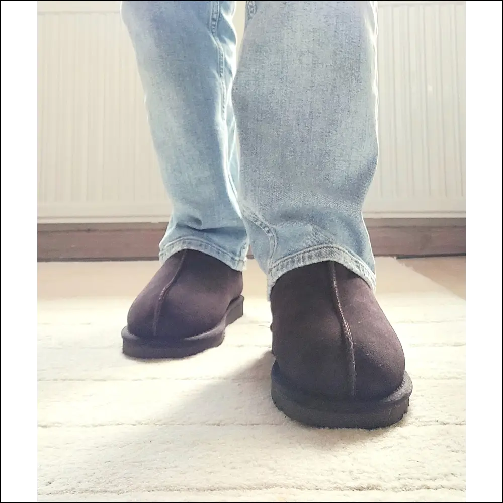 Ugg Tasman Bruna slippers in Dusted Cocoa worn with light blue jeans, showcasing comfort and style for autumn and winter.